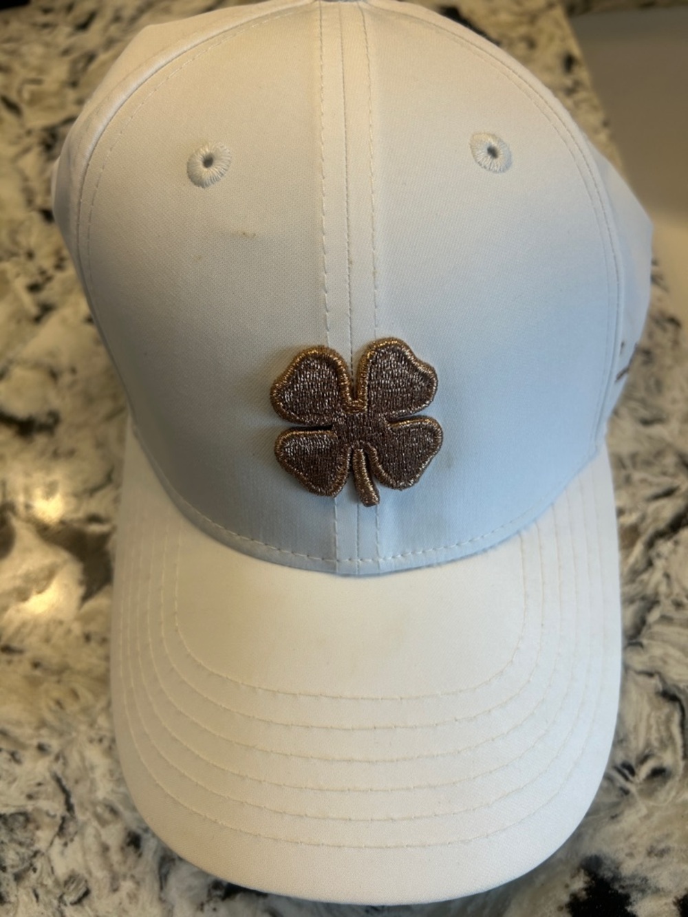 White Baseball Cap with Metallic Gold Clover Patch